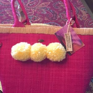 Hot Pink Pom Pom embellished raffia beach tote.